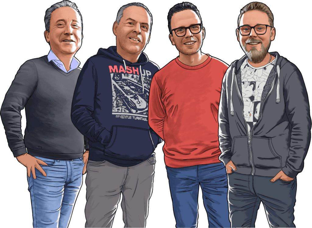 Four men standing together smiling outdoors, casual clothing, friendly atmosphere.